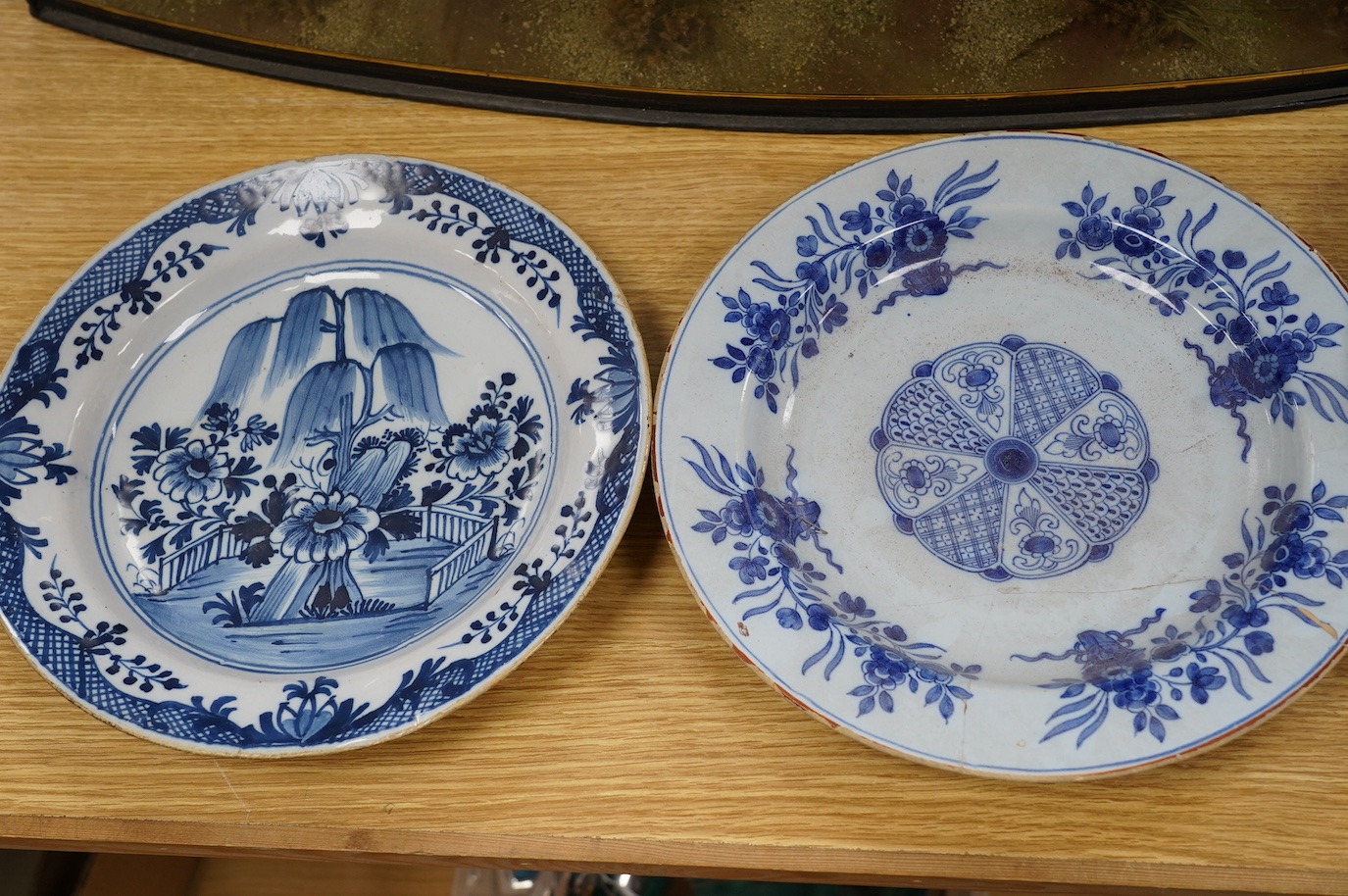 Five various delft dishes, largest 37cm diameter. Condition - poor to fair